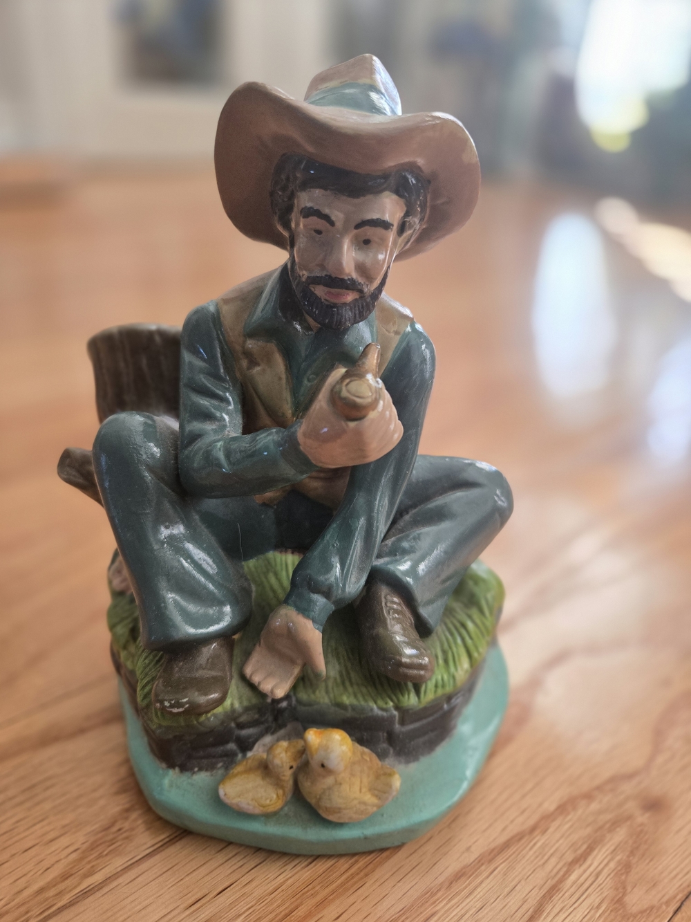 Hand-Painted Cowboy Figurine Feeding Ducks